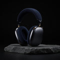 Midnight AirPods Max 2 on charcoal stone slab